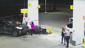 VIDEO: Woman slams into vehicle at gas station, uses baseball bat to smash hood of car