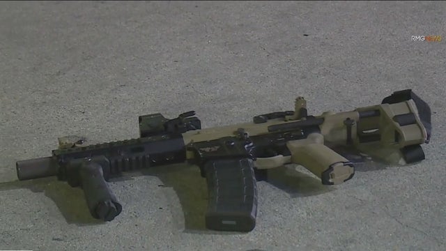 Man found shot to death with rifle next to body near downtown LA gas station