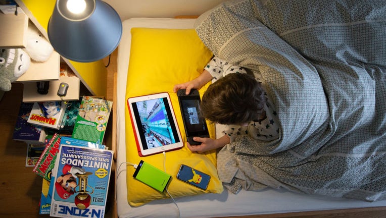 Child with game console