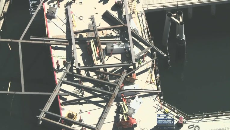 Crews are picking up the pieces after a part of a construction site collapsed at the Long Beach pier.