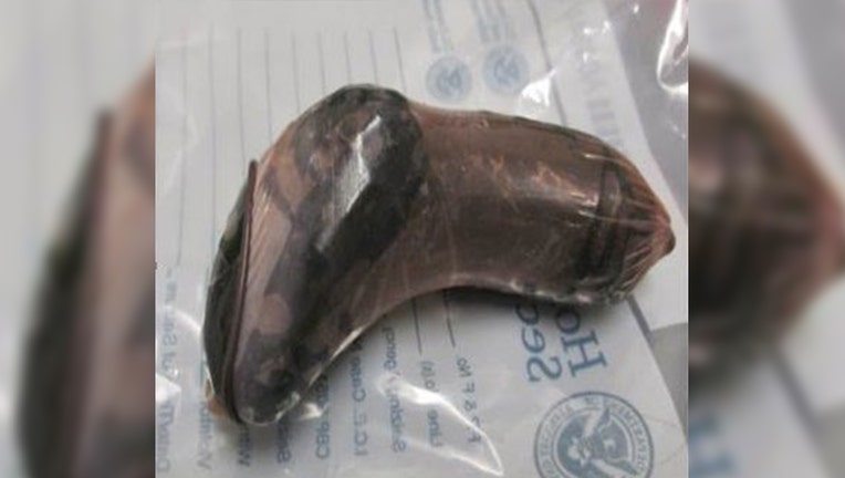 A condom filled with fentanyl pills that a woman reportedly put into her vaginal cavity in an attempt to cross the border.