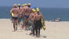 Lifeguard search efforts continue as beach crowds arrive