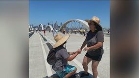 'It's surreal!' Couple over the moon after proposal on 6th Street Bridge