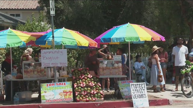 Vendor whose stand was destroyed with ax returns to work