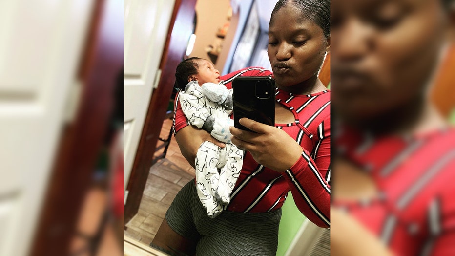 Asherey Ryan holding her infant son