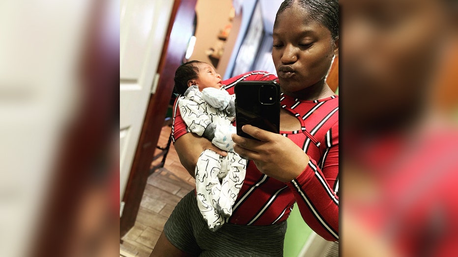 Asherey Ryan holding her infant son