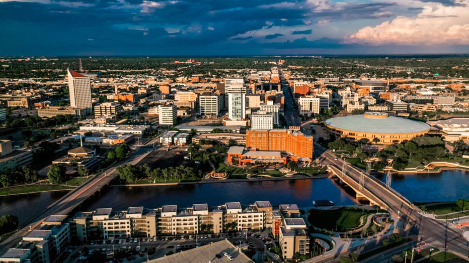 Drone aerial view of downtown Wichita Skyline features Arkansas Rivers and bridges, Kansas