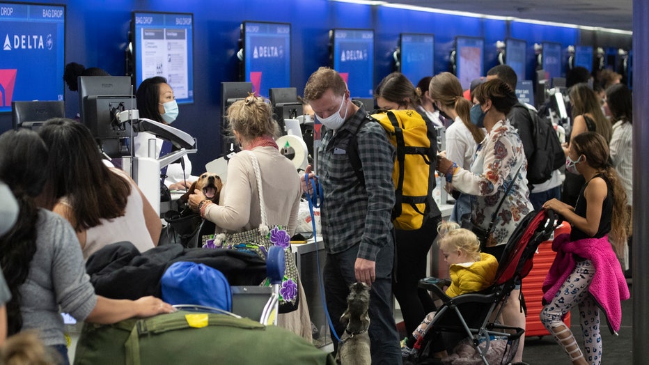 8c8bb474-Memorial Day weekend travelers at LAX