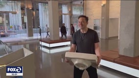 Musk carries a sink into Twitter headquarters during visit ahead of Friday deadline