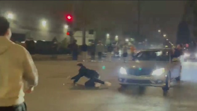 Video shows man being hit by car during street takeover in Orange County