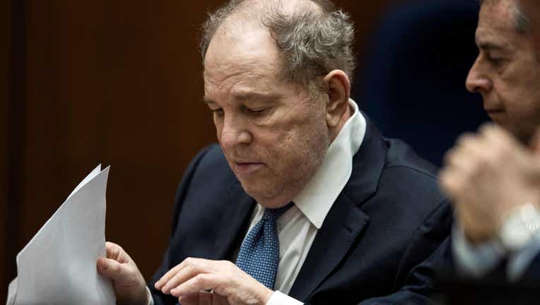 Former film producer Harvey Weinstein (L) interacts with his attorney Mark Werksman in court at the Clara Shortridge Foltz Criminal Justice Center (Photo by ETIENNE LAURENT/POOL/AFP via Getty Images).