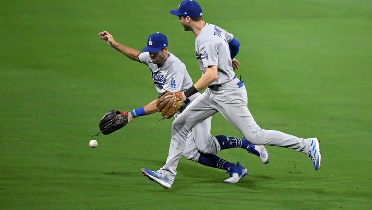 Trea Turner of the Los Angeles Dodgers drops a ball hit by Jake Cronenworth #9 of the San Diego Padres during the third inning in game three of the NLDS. (Photo by Denis Poroy/Getty Images)