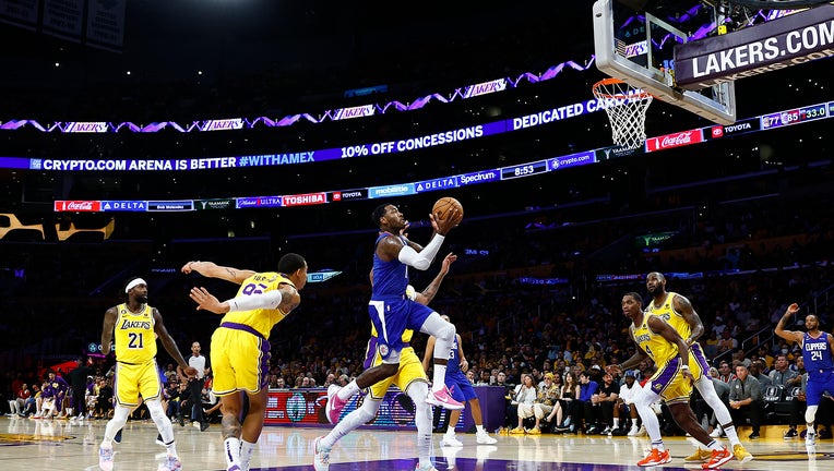 John Wall #11 of the LA Clippers takes a shot against the Los Angeles Lakers. (Photo by Ronald Martinez/Getty Images)