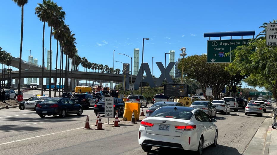 Traffic impacted outside LAX due to standoff with pursuit suspect.