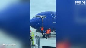 Southwest Airlines pilot hangs from window to retrieve passenger’s lost phone