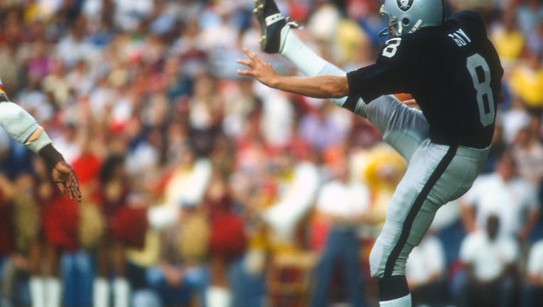 Los Angeles Raiders punts the ball against the Washington Redskins during an NFL football game October 2, 1983 at RFK Stadium in Washington, D.C.. Guy played for the Raiders from 1973-86. (Photo by Focus on Sport/Getty Images)