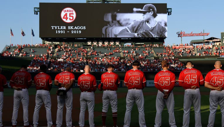 The Los Angeles Angels of Anaheim stand for a moment of silence before they play the Seattle Mariners. The entire Angels team wore #45 on their jersey to honor Skaggs who died on July 1. (Photo by John McCoy/Getty Images)