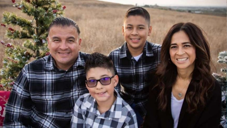 Photo of LAPD Motor Officer Michael Tomelloso and his wife, Laura, and their two children, Mike Jr., 14, and Matthew, 10.