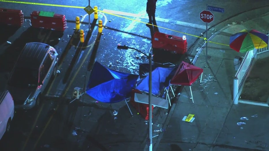 A broken blue pop-up tent on the street, at the scene of a hit-and-run in South LA