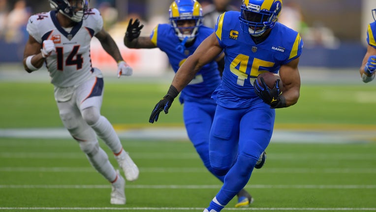Bobby Wagner #45 of the Los Angeles Rams runs with the ball after catching an interception during the first quarter of the game against the Denver Broncos at SoFi Stadium. (Photo by Jayne Kamin-Oncea/Getty Images)