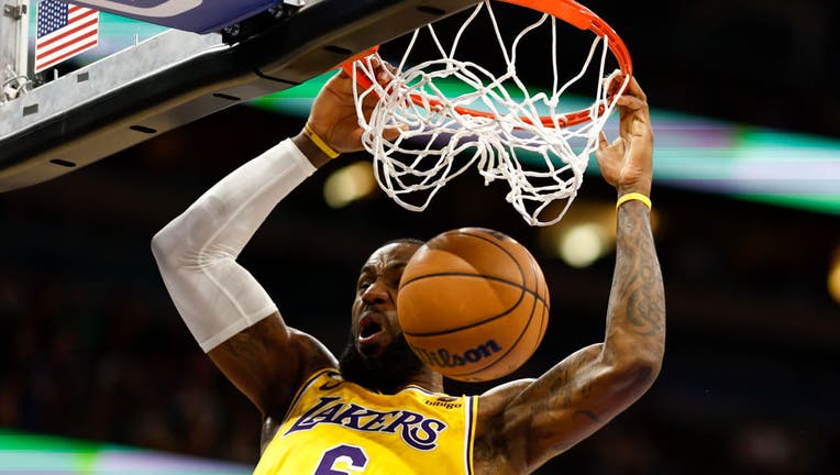 LeBron James #6 of the Los Angeles Lakers slams the ball against the Orlando Magic at Amway Center on December 27, 2022 in Orlando, Florida. (Photo by Douglas P. DeFelice/Getty Images)