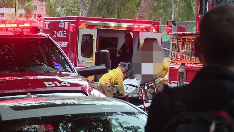 A student is loaded into an ambulance by paramedics after apparently overdosing on cannabis edibles.