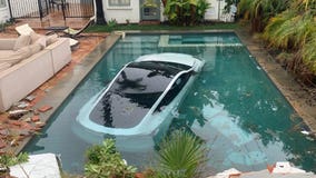 Tesla drives into Pasadena pool with 3 people inside, including child