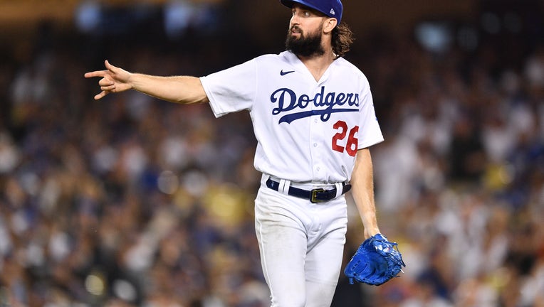 Los Angeles Dodgers pitcher Tony Gonsolin (26) celebrates after a double play ends an inning during the MLB game between the Milwaukee Brewers and the Los Angeles Dodgers on August 23, 2022 at Dodger Stadium in Los Angeles, CA. (Photo by Brian Rothmuller/Icon Sportswire via Getty Images)