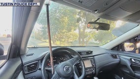 Metal rod impales car's windshield, narrowly missing driver