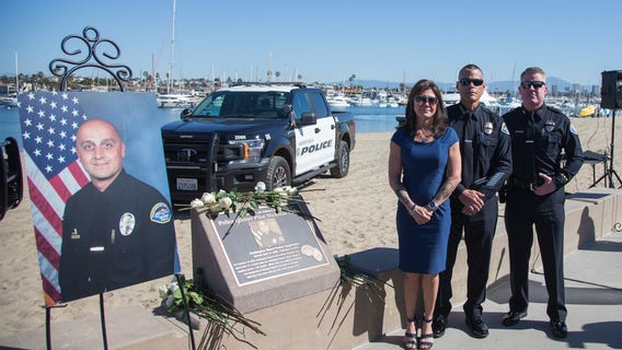 Huntington Beach officer killed in helicopter crash honored with plaque at beach where he died