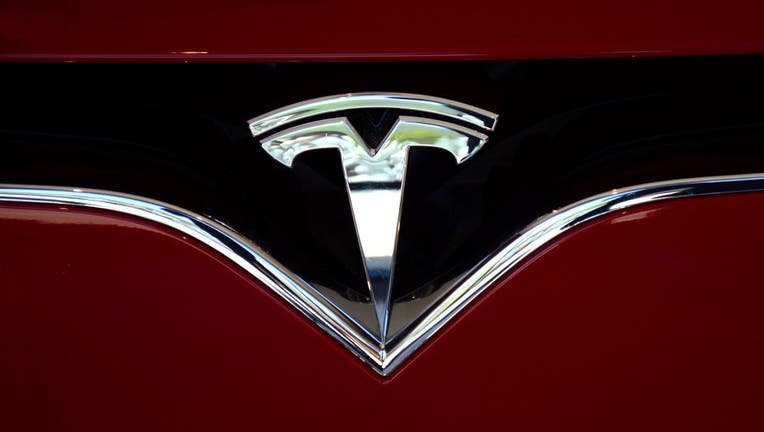 The Tesla brand logo embellishes the nose of a Tesla electric sedan in Vail, Colorado. (Photo by Robert Alexander/Getty Images)