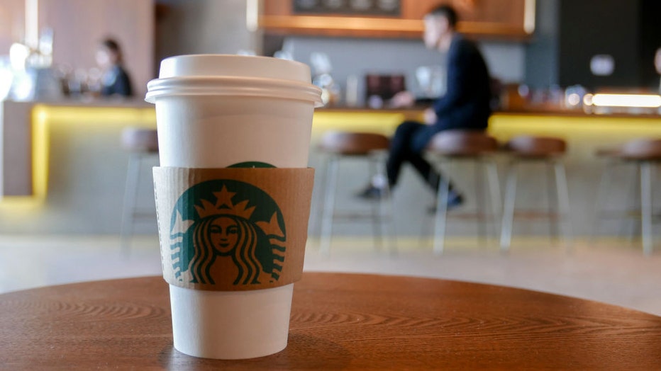 A coffee cup in a Starbucks coffee shop, arranged for