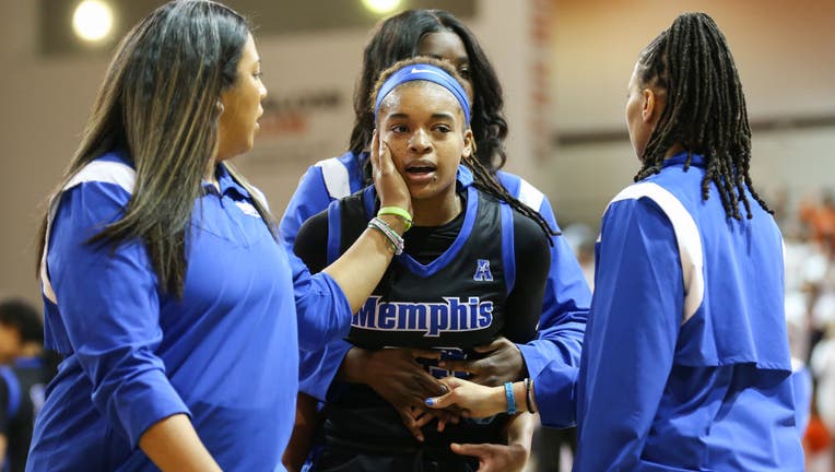 Memphis Tigers guard Jamirah Shutes (23) is escorted off of the court after an altercation with Bowling Green Falcons guard Elissa Brett (not pictured) during the postgame handshake following a third round college womens basketball game of the Womens National Invitational Tournament. (Photo by Scott W. Grau/Icon Sportswire via Getty Images)