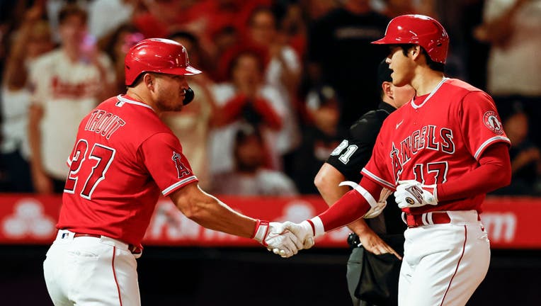 Shohei Ohtani #17 of the Los Angeles Angels celebrates with his teammate Mike Trout #27 after hitting a two-run home run against the New York Yankees on August 29, 2022 in Anaheim, California. (Photo by Michael Owens/Getty Images)
