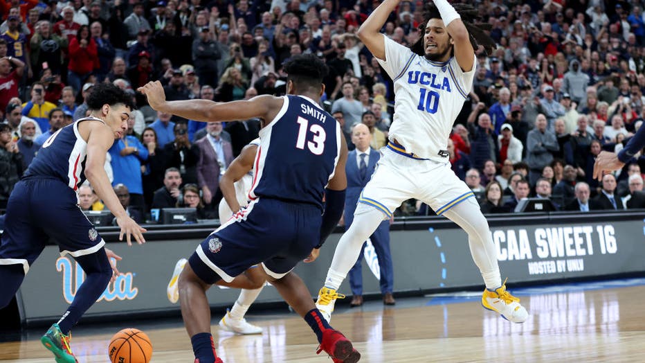 Tyger Campbell #10 of the UCLA Bruins loses control of the ball against Julian Strawther #0 and Malachi Smith #13 of the Gonzaga Bulldogs during the second half in the Sweet 16 round of the NCAA Men's Basketball Tournament. (Photo by Sean M. Haffey/Getty Images)