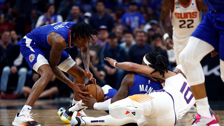 Bones Hyland #5 of the LA Clippers grabs a loose ball against the Phoenix Suns in the first half of Game Three of the Western Conference First Round Playoffs at Crypto.com Arena on April 20, 2023 in Los Angeles, California. (Photo by Ronald Martinez/Getty Images)