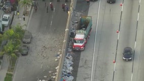 2 hurt, debris rain down on South LA neighborhood after 110 Freeway crash