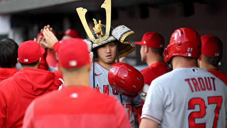 Shohei Ohtani #17 of the Los Angeles Angels celebrates in the dugout after hitting a three run home run during the fourth inning against the Baltimore Orioles. (Photo by Patrick Smith/Getty Images)