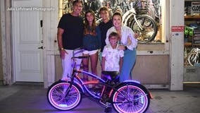 Bike donated to 8-year-old boy with cystic fibrosis ahead of the Glow Ride