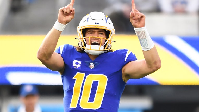 Justin Herbert (10) celebrates during the NFL regular season game between the Tennessee Titans and the Los Angeles Chargers. (Photo by Brian Rothmuller/Icon Sportswire via Getty Images)