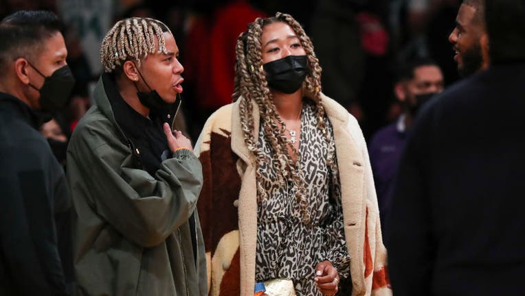 Tennis star Naomi Osaka and entertainer Cordae attend the game between the Los Angeles Lakers and the Phoenix Suns at Staples Center. (Photo by Meg Oliphant/Getty Images )