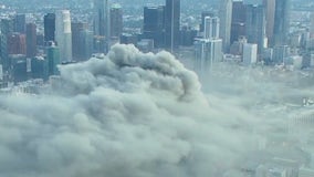 Plume of smoke seen for miles after massive fire erupts in downtown Los Angeles