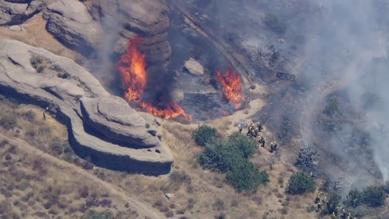 Crews battle fire threatening home in Agua Dulce
