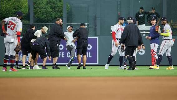 Fans rush field, incident ends with Atlanta Braves star Ronald Acuña Jr. knocked to ground