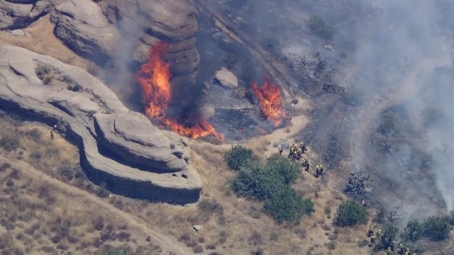 Crews battle fire threatening home in Agua Dulce