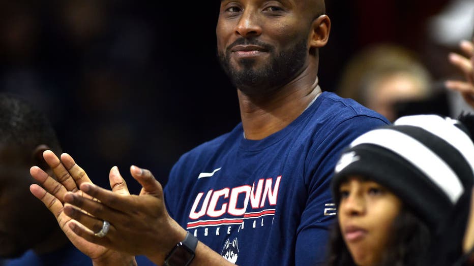 Kobe Bryant applauds the UConn seniors on Senior Day at Gampel Pavilion Saturday. UConn beat Houston 83-61. (Brad Horrigan/Tribune News Service via Getty Images via Getty Images)