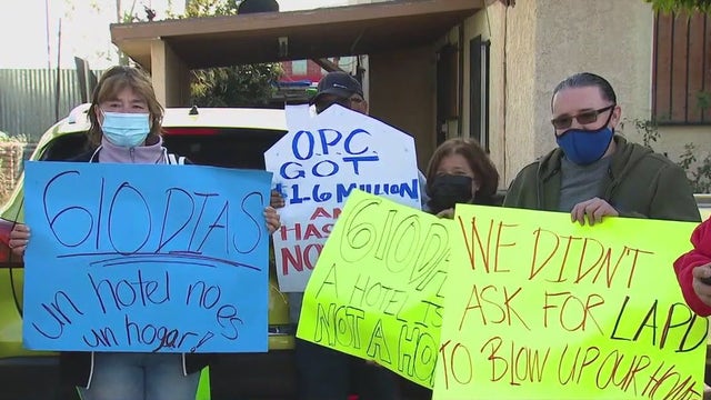 Victims of botched LAPD fireworks explosion protest outside Bass' home