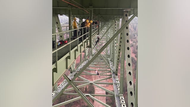 Teen found dangling from California's highest bridge rescued