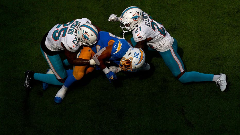 Hill helps Dolphins find end zone, but Chargers win