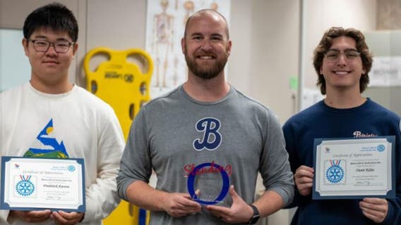 High school trainer, 2 students save coach after he collapsed during football game